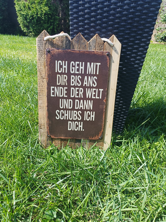 Metal sign “I’ll go with you to the end of the world – and then I’ll push you, on scrap wood